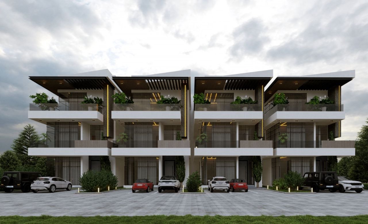 Modern luxury KAIVRA residential building with vehicles parked in the driveway